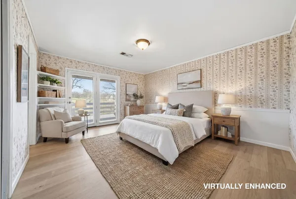 a spacious bedroom with a bed and a large window