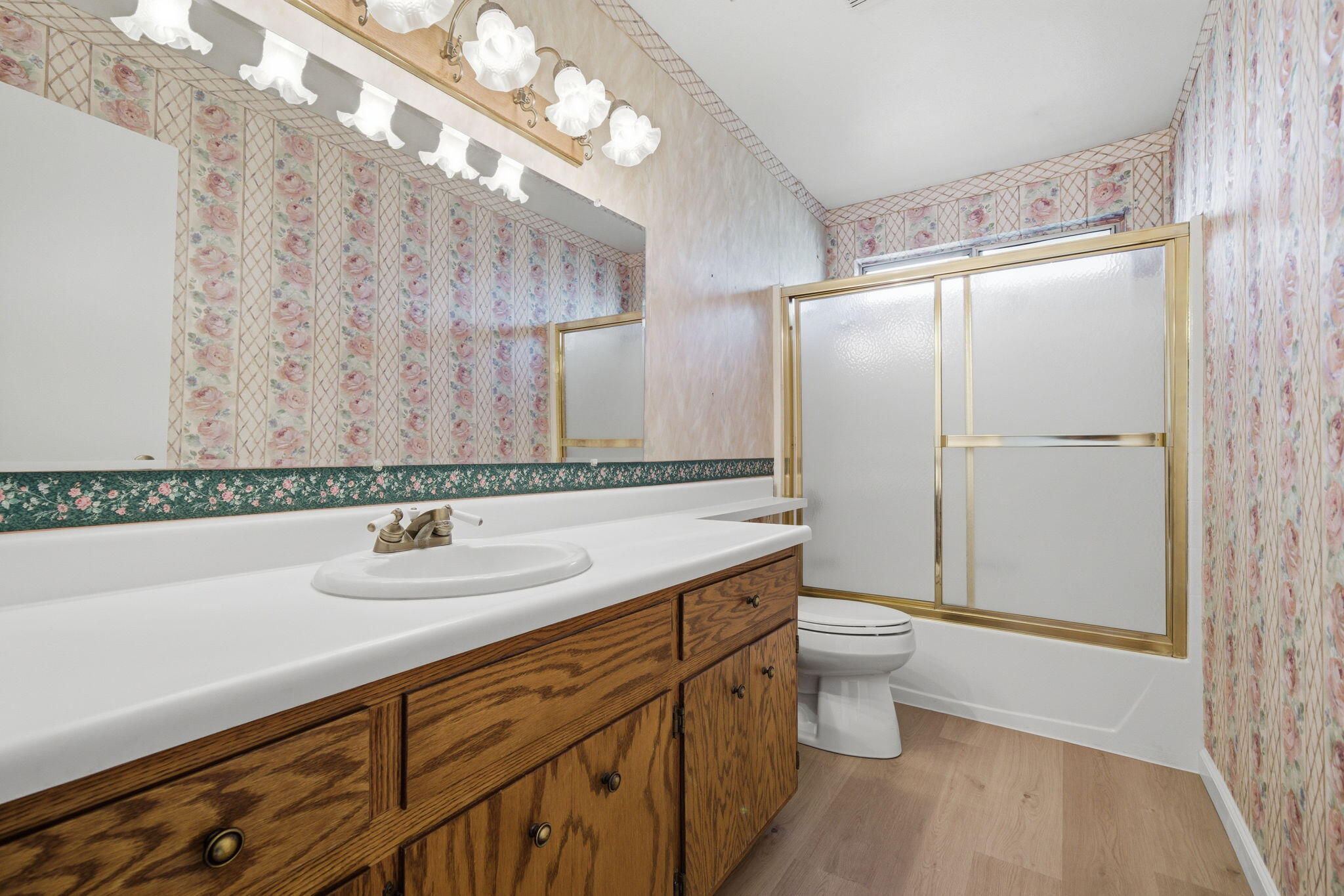 14435 Del Oro Court Red Bluff, CA 96080 - Photo 19 of 28 a bathroom with a sink a toilet and shower