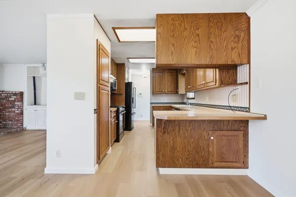a view of cabinets and wooden floor