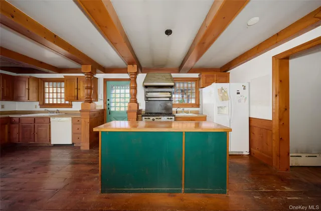 a kitchen with a table and chairs