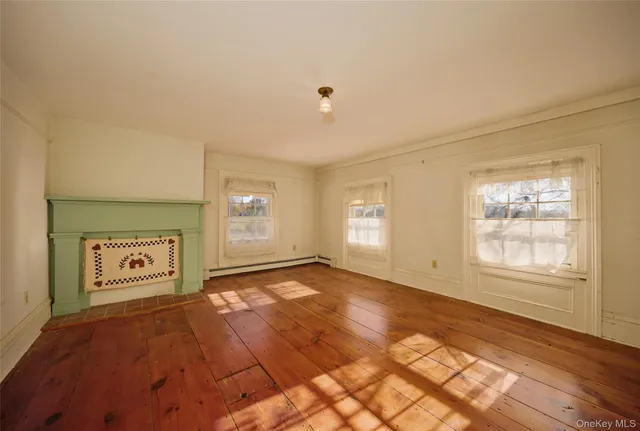 a view of an empty room and a window