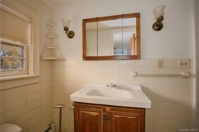 a bathroom with a sink and mirror