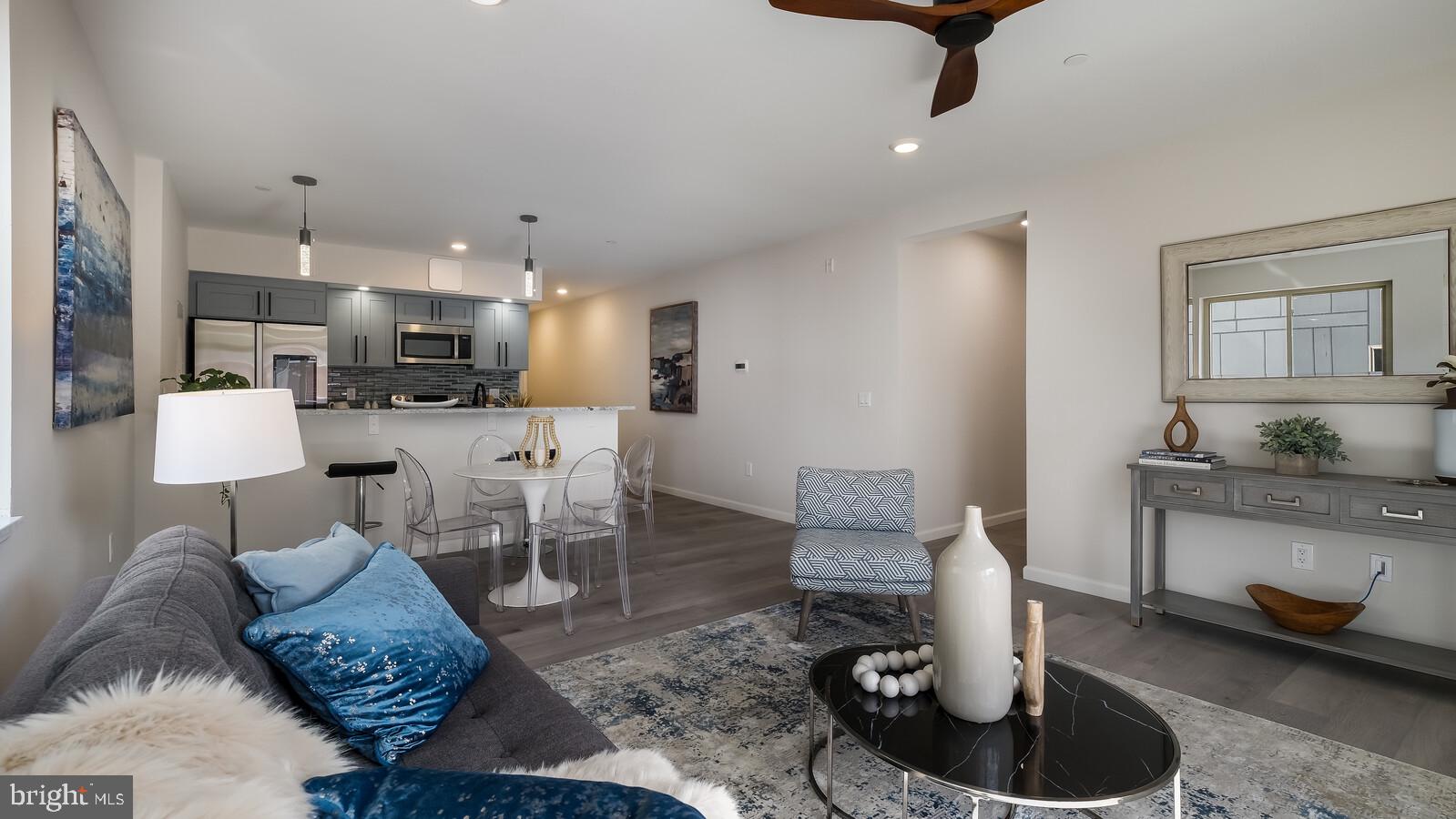 1825 Callowhill Street, Unit 311 Philadelphia, PA 19130 - Photo 13 of 50 a living room with furniture and kitchen view