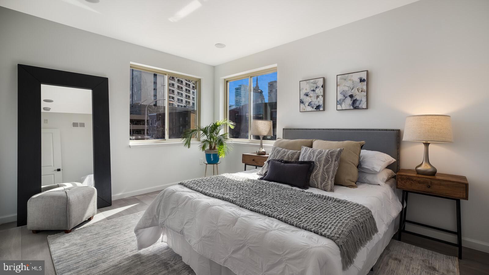 1825 Callowhill Street, Unit 311 Philadelphia, PA 19130 - Photo 20 of 50 a bedroom with bed and a lamp