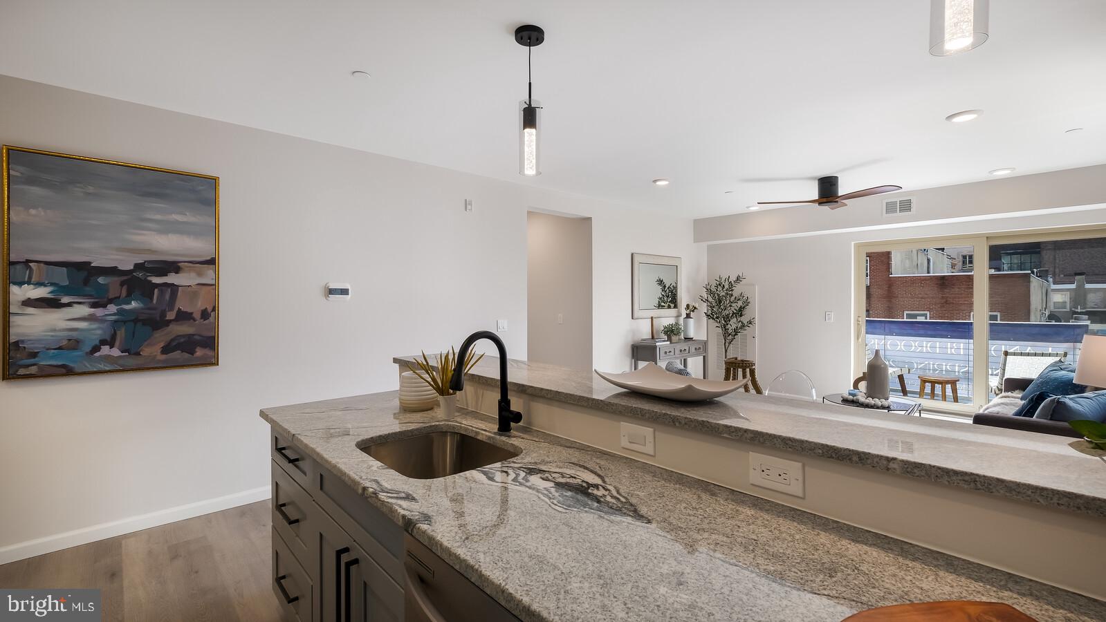 1825 Callowhill Street, Unit 311 Philadelphia, PA 19130 - Photo 7 of 50 a kitchen with a sink a stove and cabinets