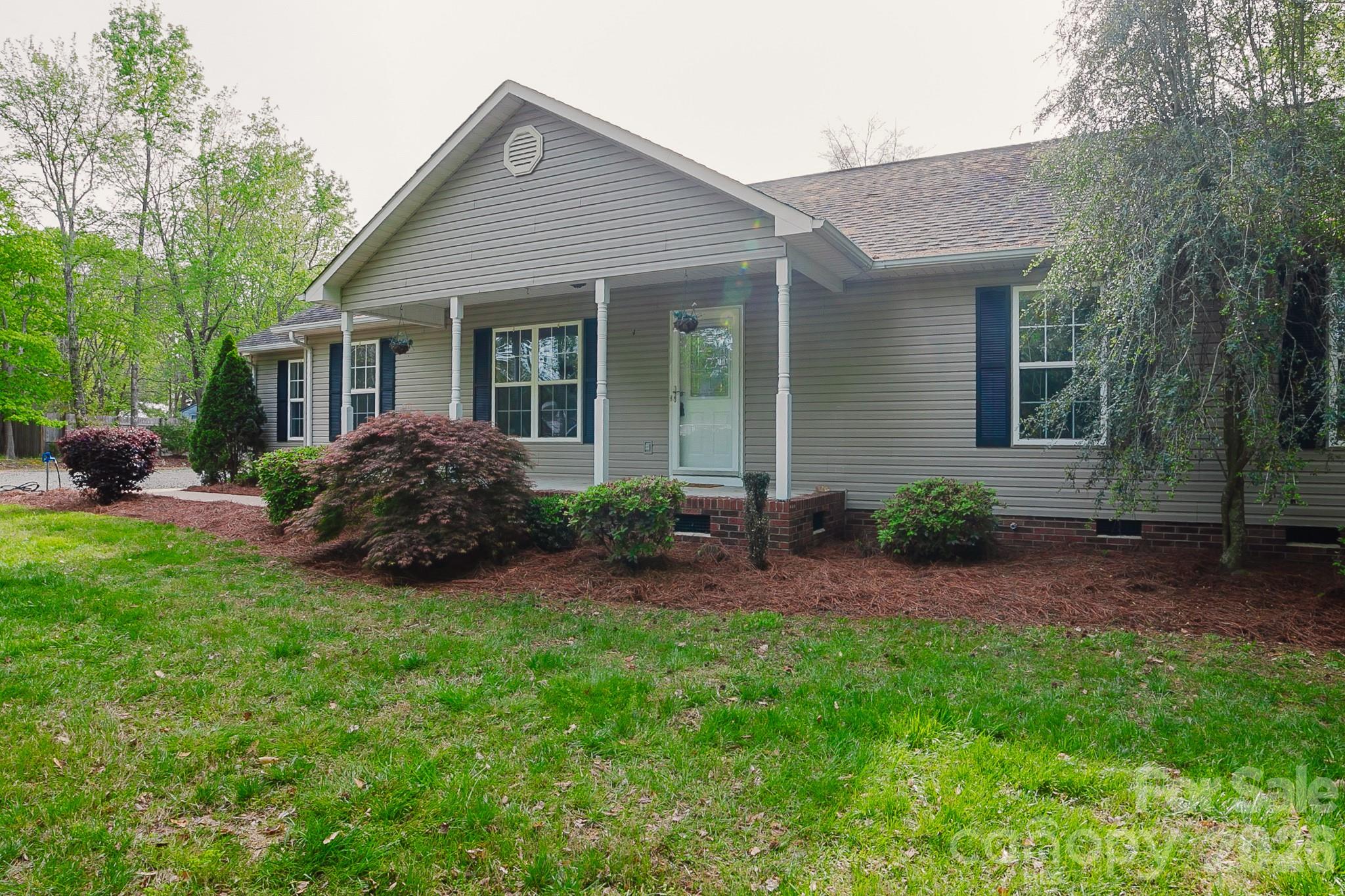 2104 Badin Road Albemarle, NC 28001 - Photo 1 of 46 a front view of house with yard and green space
