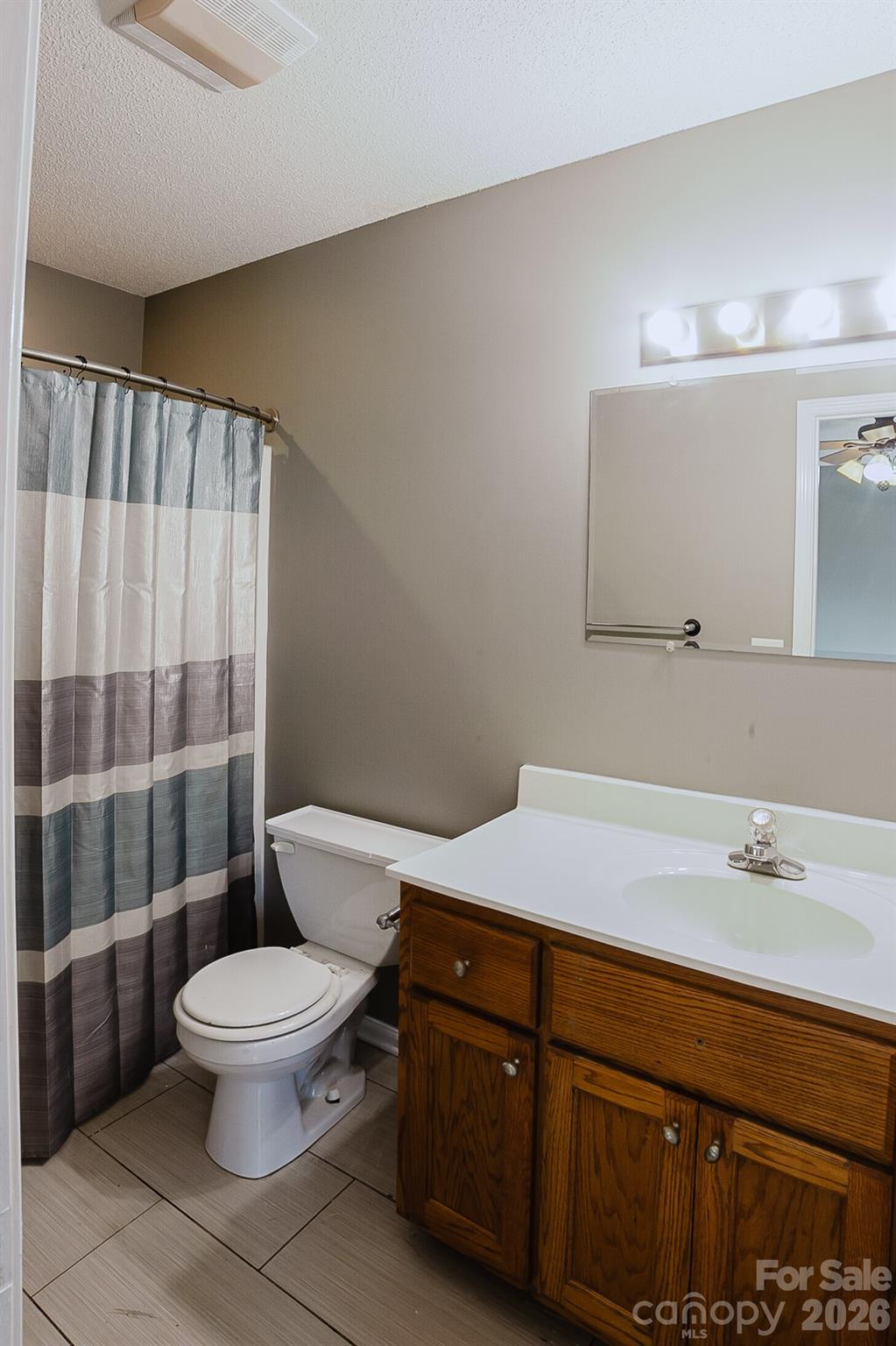 2104 Badin Road Albemarle, NC 28001 - Photo 17 of 46 a bathroom with a sink a toilet and shower