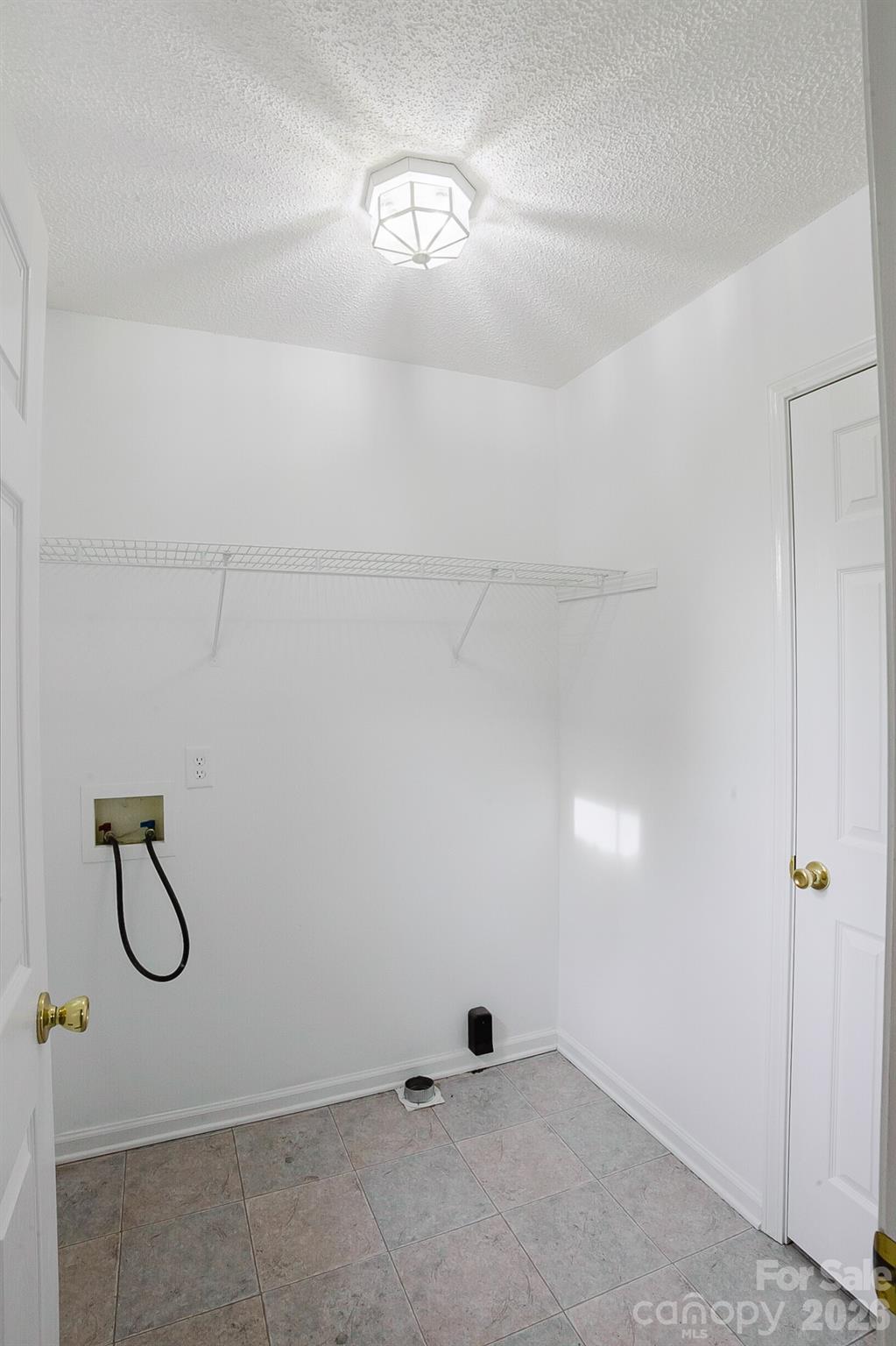 2104 Badin Road Albemarle, NC 28001 - Photo 24 of 46 a view of a room with racks on the wall