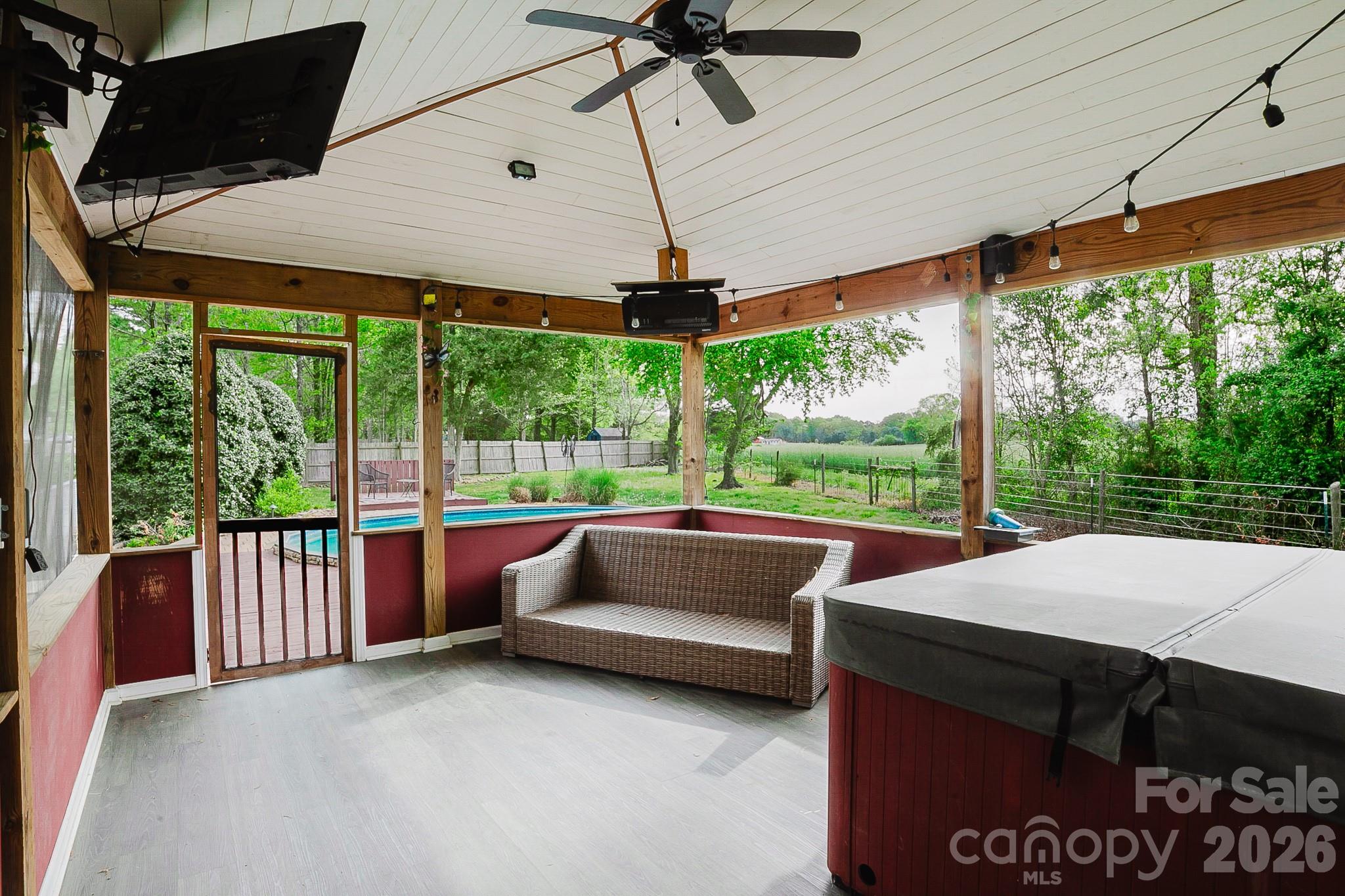 2104 Badin Road Albemarle, NC 28001 - Photo 28 of 46 a living room with furniture and a floor to ceiling window