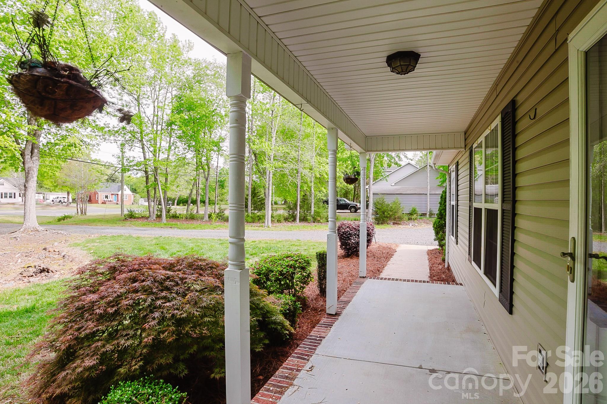 2104 Badin Road Albemarle, NC 28001 - Photo 36 of 46 a view of a porch with furniture and garden