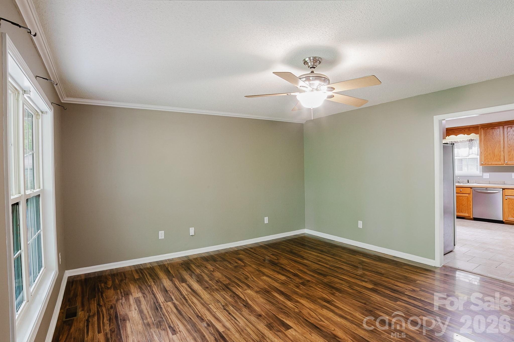 2104 Badin Road Albemarle, NC 28001 - Photo 4 of 46 wooden floor in an empty room with a window