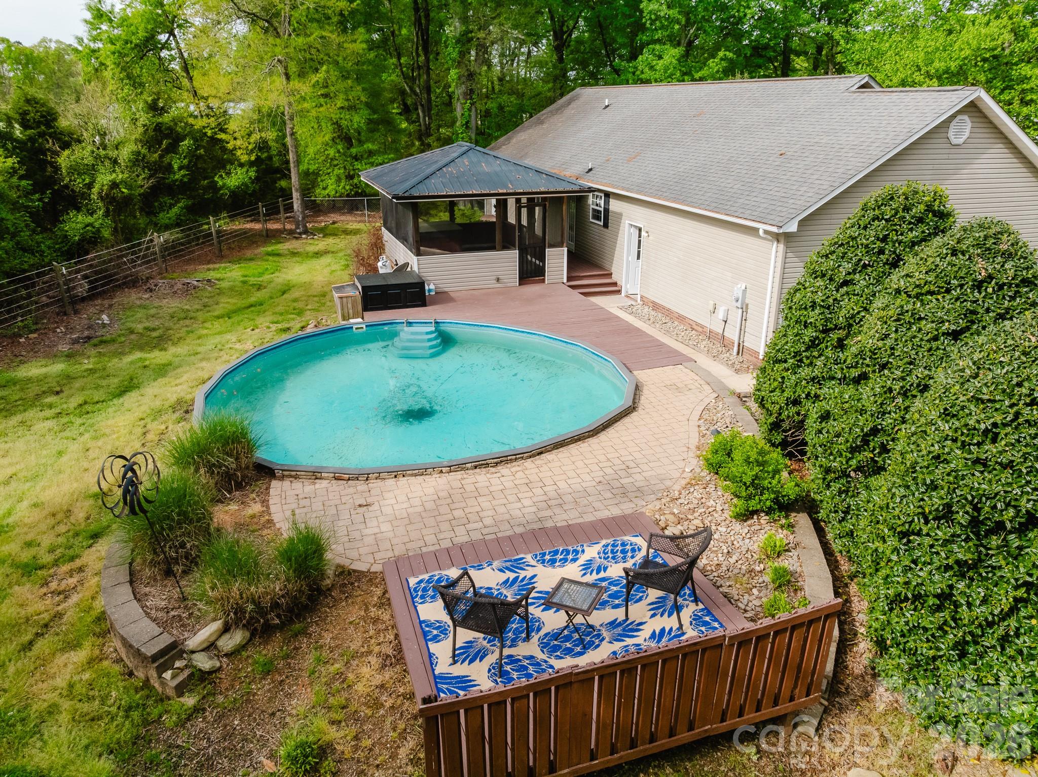 2104 Badin Road Albemarle, NC 28001 - Photo 44 of 46 an outdoor space with furniture and umbrella