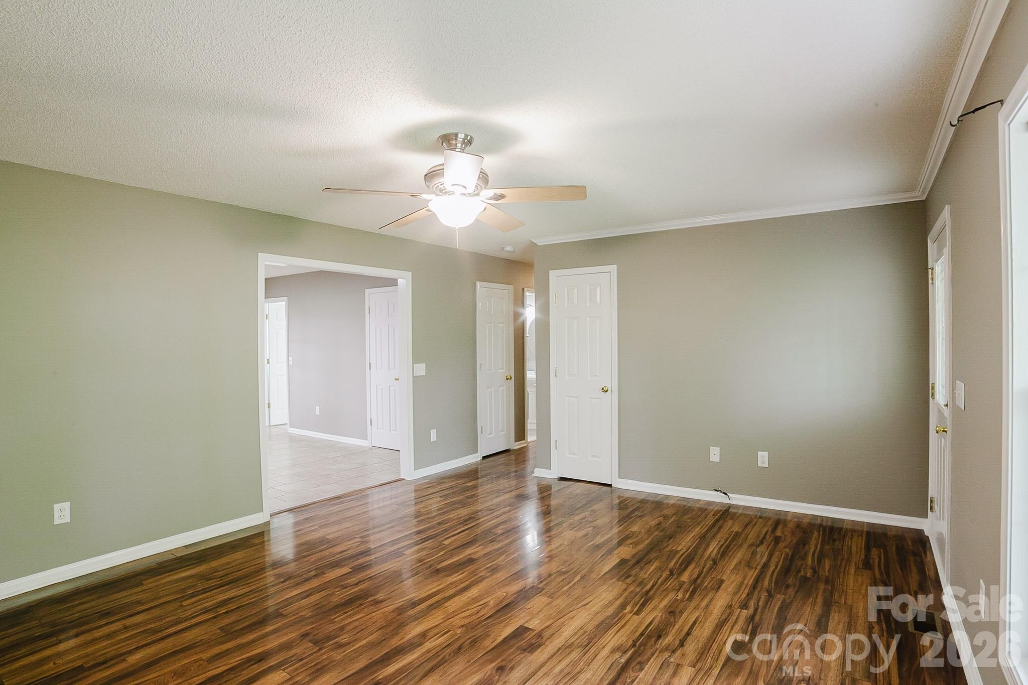 2104 Badin Road Albemarle, NC 28001 - Photo 7 of 46 wooden floor in an empty room with a window
