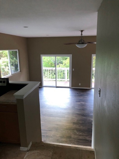 1565 Haiku Road, Unit 2 Haiku, HI 96708 - Photo 9 of 26 a view of kitchen with window and wooden floor