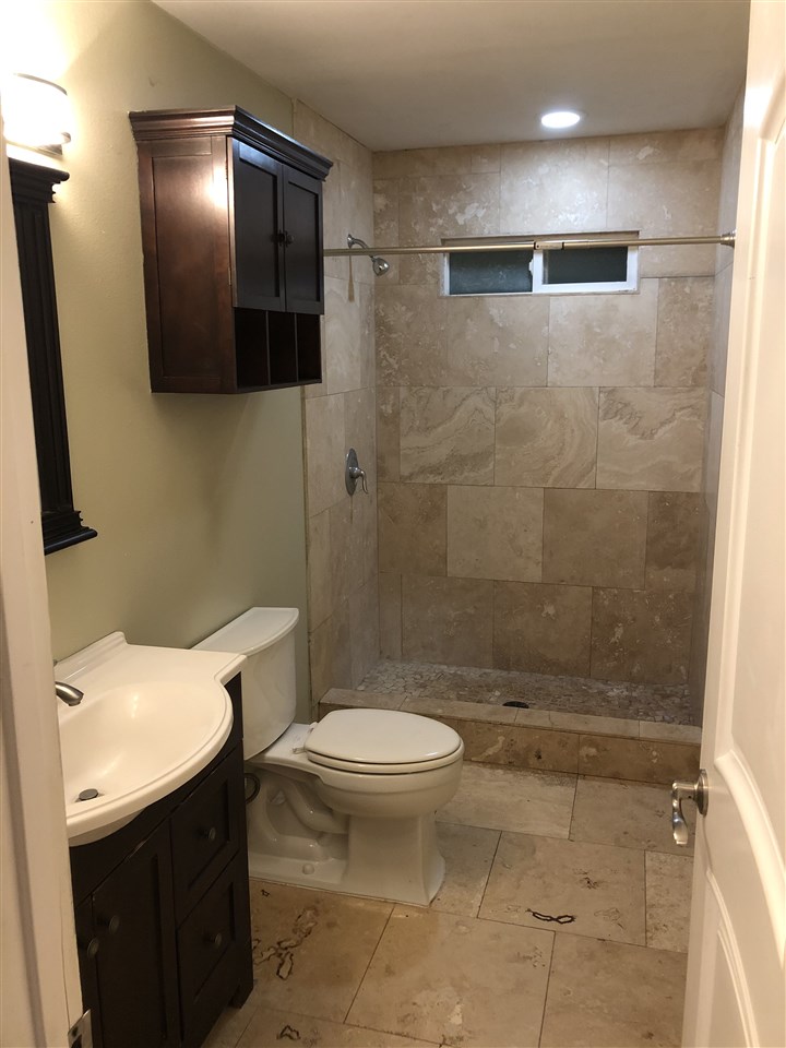 1565 Haiku Road, Unit 2 Haiku, HI 96708 - Photo 10 of 26 a bathroom with a sink a toilet and shower
