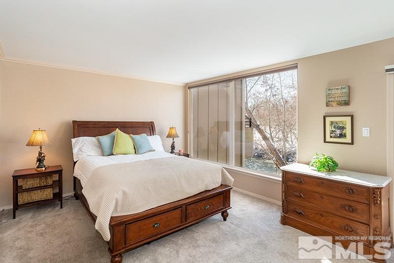 1344 Jones Street Reno, NV 89503 - Photo 14 of 24 a spacious bedroom with a bed and a window