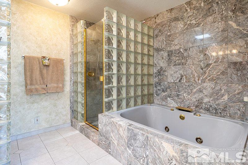 1344 Jones Street Reno, NV 89503 - Photo 17 of 24 a bathroom with a bathtub and shower