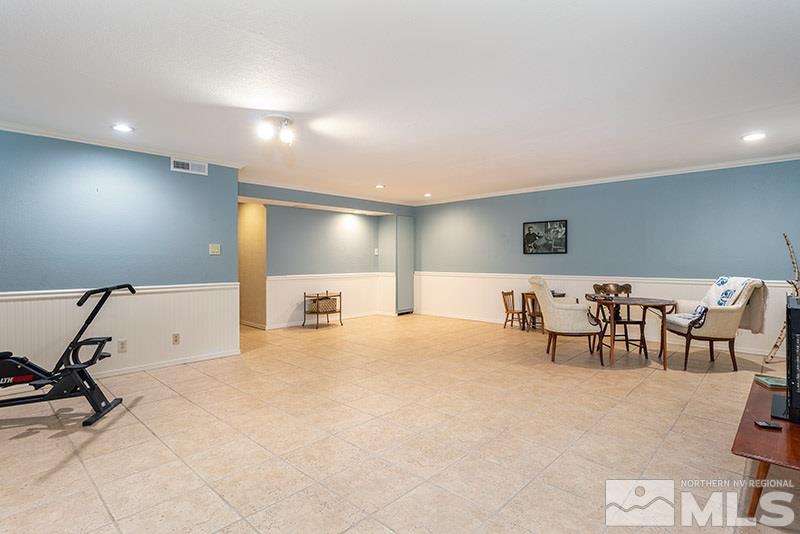 1344 Jones Street Reno, NV 89503 - Photo 21 of 24 a spacious bedroom with a bed a table and chair