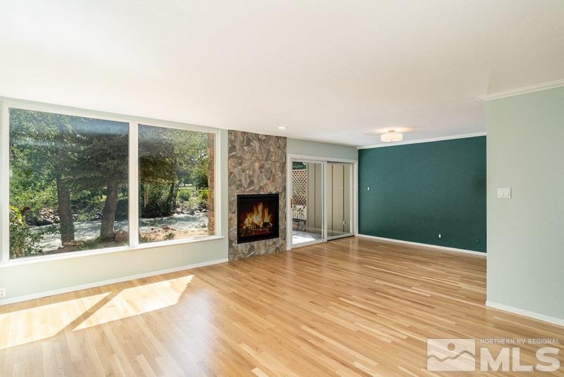 1344 Jones Street Reno, NV 89503 - Photo 4 of 24 a view of empty room with wooden floor and fireplace