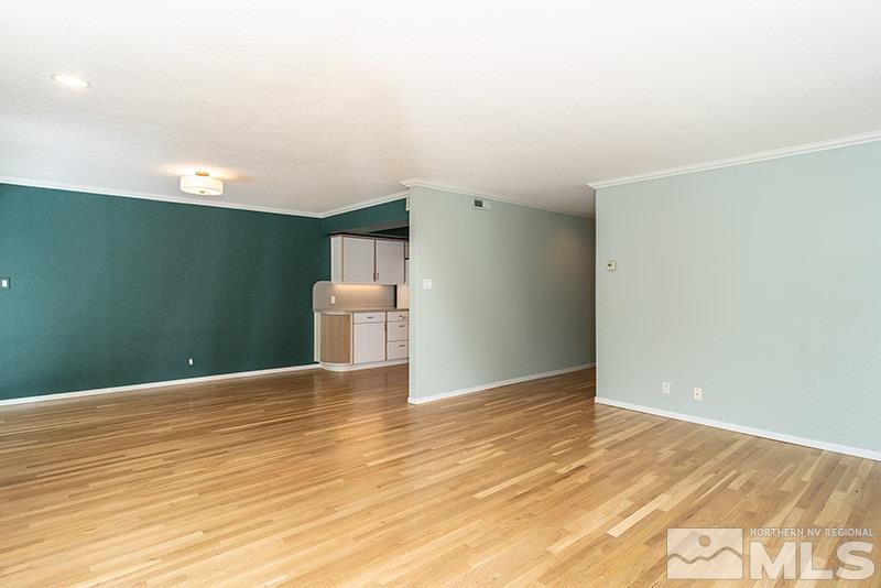 1344 Jones Street Reno, NV 89503 - Photo 7 of 24 a view of a livingroom with wooden floor and staircase
