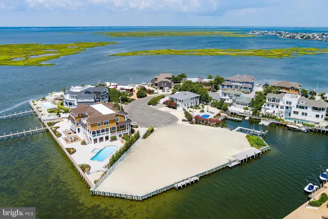 an aerial view of a house with a ocean view