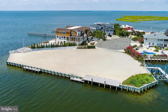 a swimming pool with outdoor seating and yard