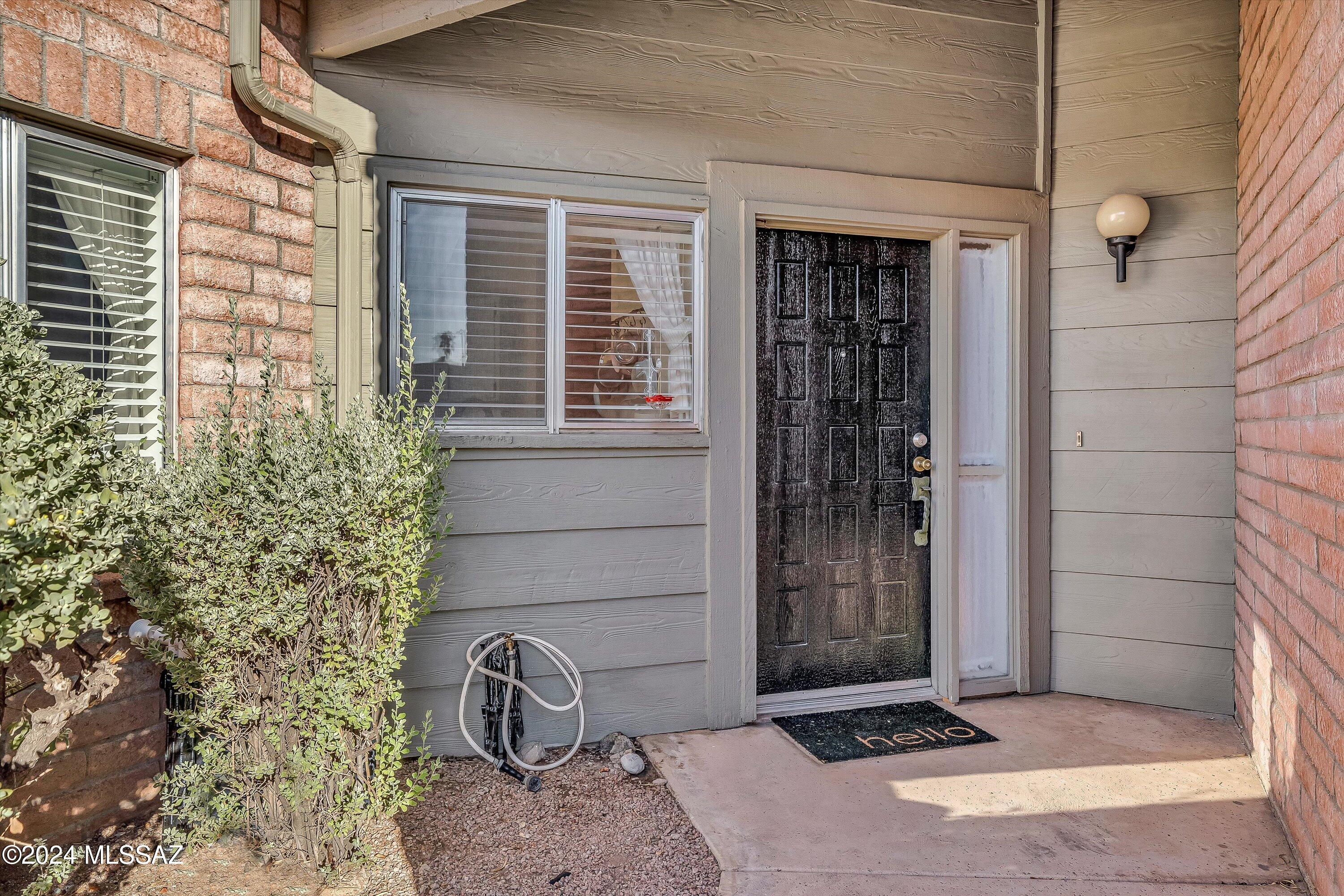 4309 East Presidio Road Tucson, AZ 85712 - Photo 3 of 28 a view of a door and chair in the porch