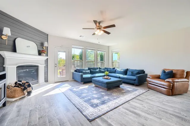 a living room with furniture and a fireplace