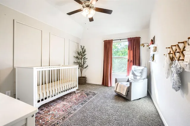 a view of a bedroom with furniture and windows