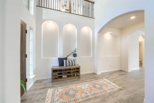 a view of hall way with furniture