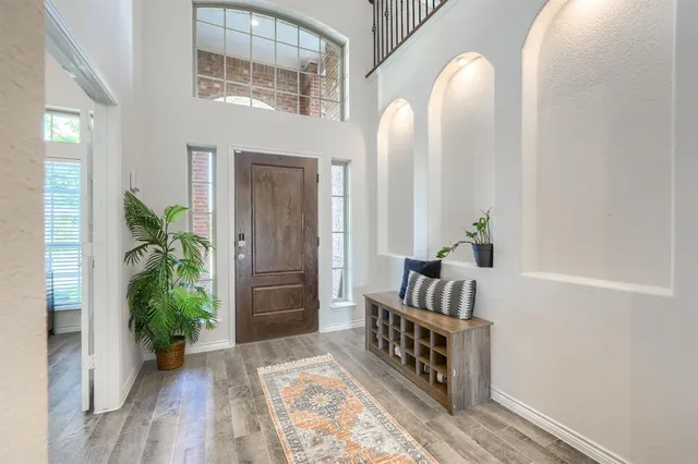 a view of living room and hardwood floor
