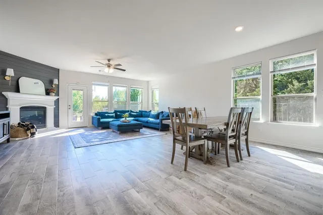 a view of a dining room with furniture window and wooden floor