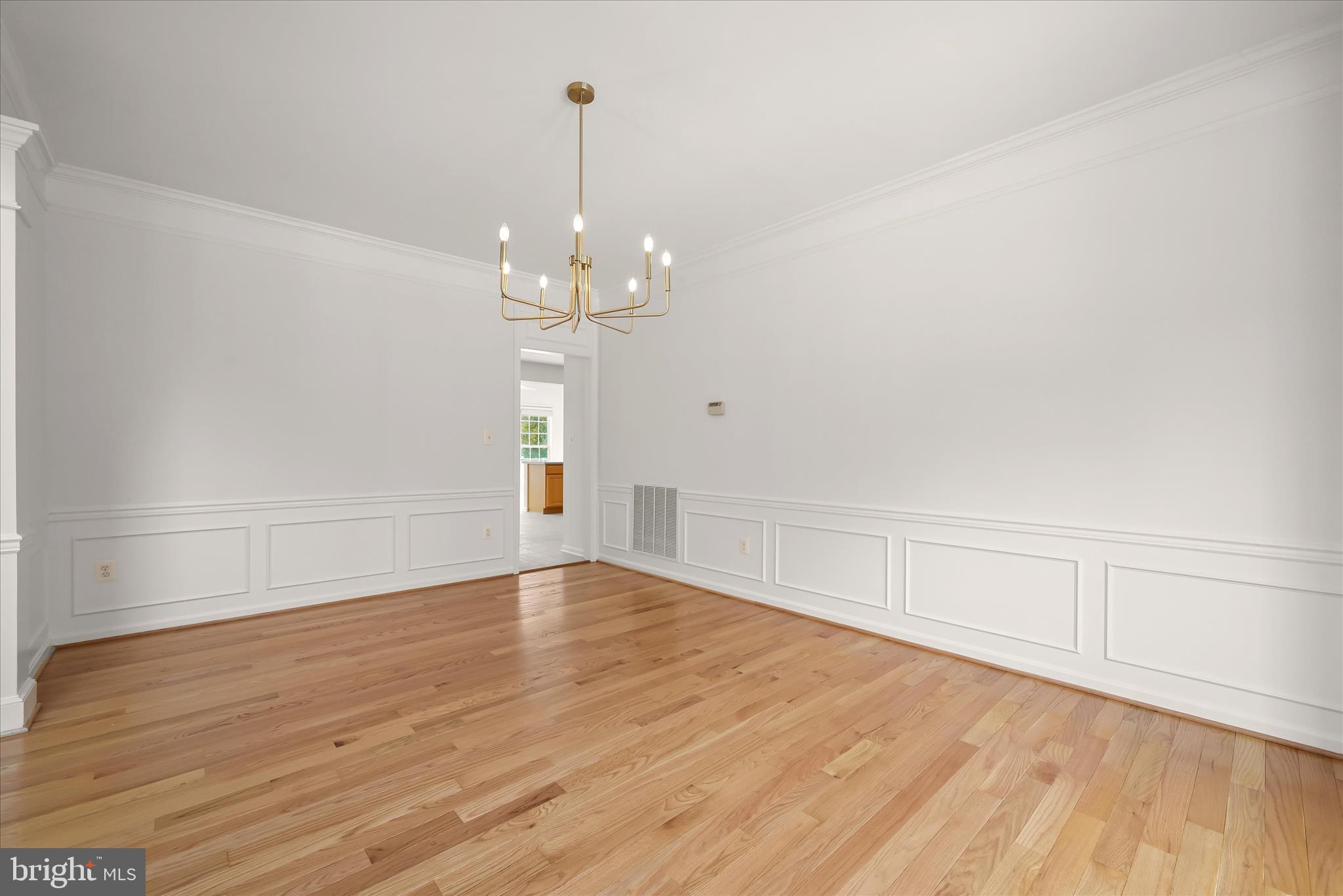 8433 Roberts Road Ellicott City, MD 21043 - Photo 16 of 84 Hardwood flooring, accent molding, and new chandel