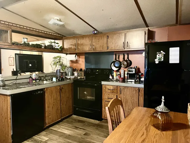 a kitchen with a sink and a stove