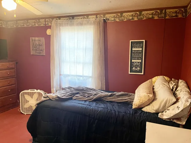 a bedroom with a bed and closet