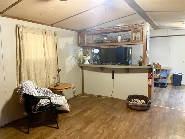 a room with furniture and a window