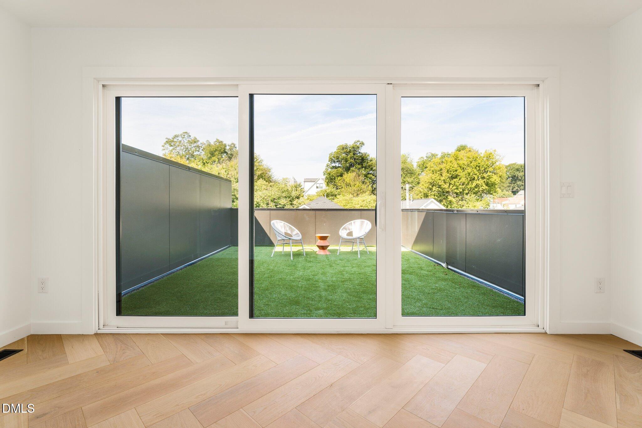409 Alston Street, Unit 101 Raleigh, NC 27601 - Photo 26 of 39 Sliding doors onto roof top terrace