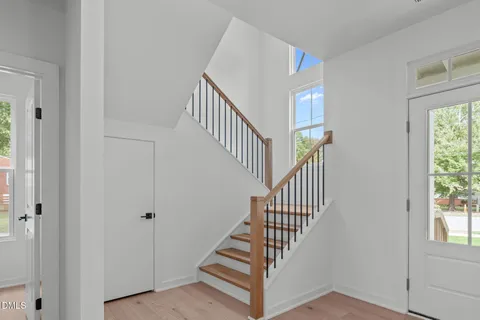 a bathroom with a granite countertop sink double and mirror