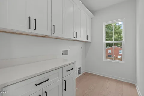 an aerial view of a house with a garden and trees
