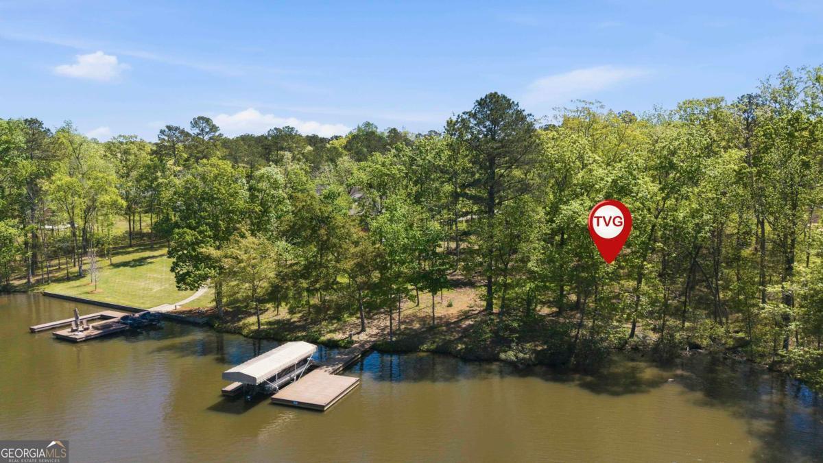 1310 Sailview Drive Buckhead, GA 30625 - Photo 4 of 16 a aerial view of a house with swimming pool and lake view