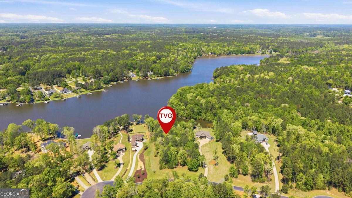 1310 Sailview Drive Buckhead, GA 30625 - Photo 7 of 16 a view of a lake with a city