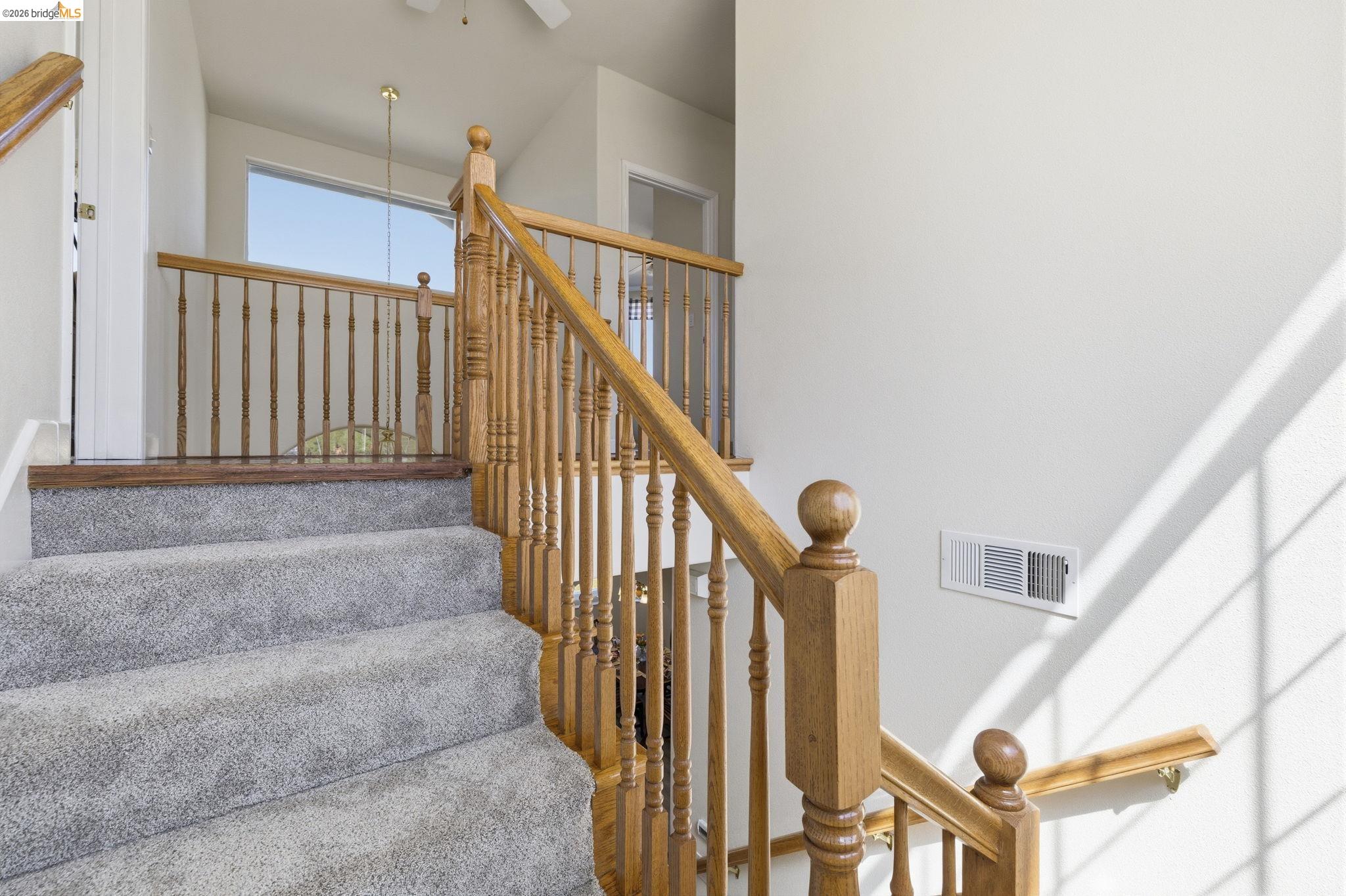 6242 Bluff View Road Copperopolis, CA 95228 - Photo 27 of 59 Newly carpeted stairs with wood banisters
