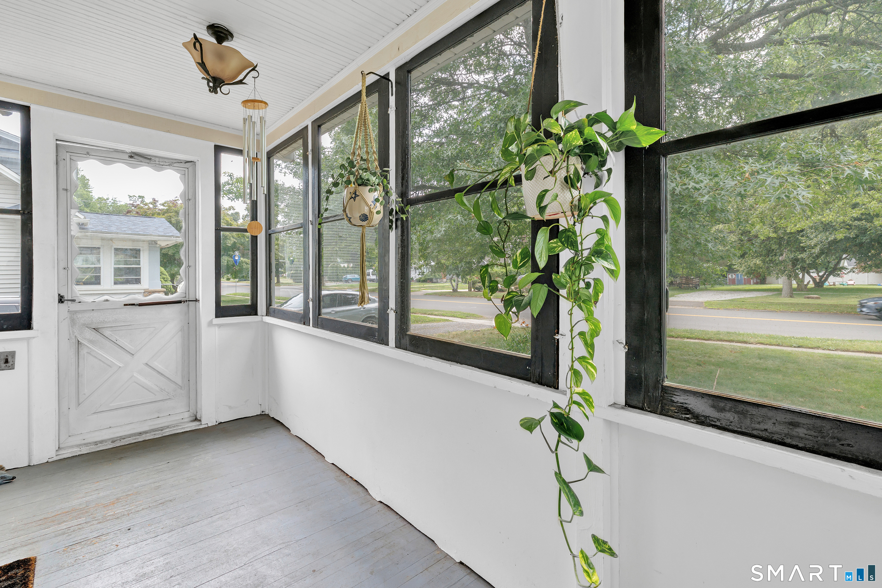 1326 Huntington Road Stratford, CT 06614 - Photo 5 of 37 Front of the house offers a enclosed closed porch to relax and unwind