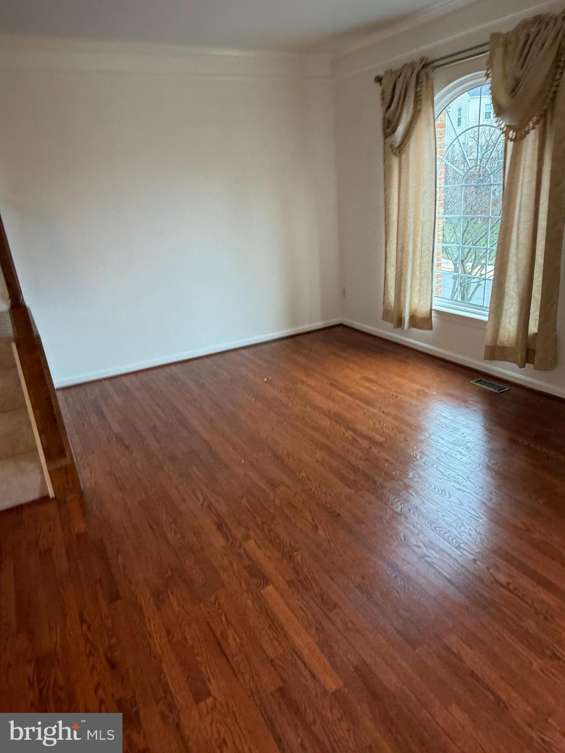 12976 Park Crescent Circle Herndon, VA 20171 - Photo 12 of 15 an empty room with wooden floor and windows