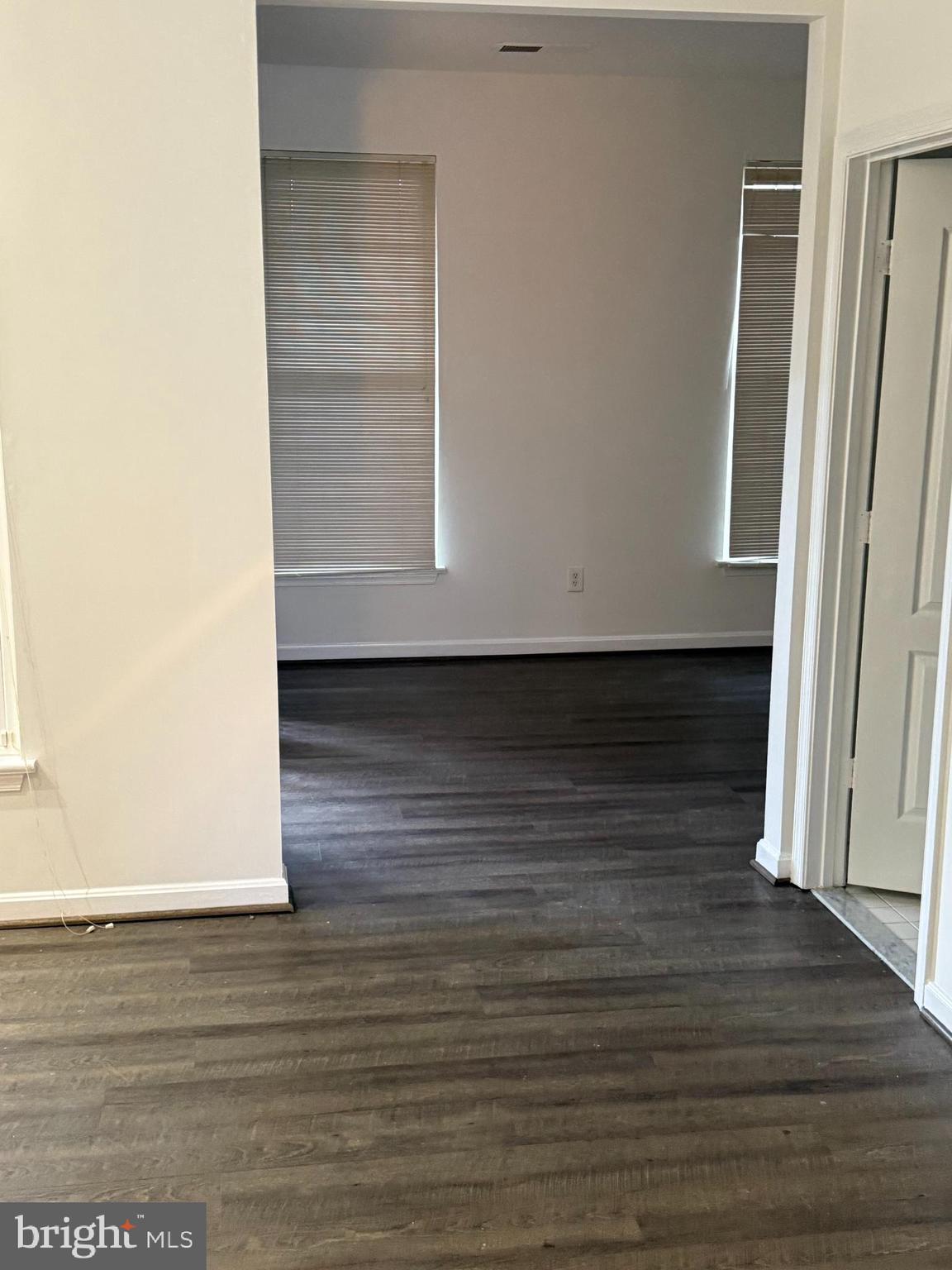 12976 Park Crescent Circle Herndon, VA 20171 - Photo 3 of 15 a view of walk in closet with wooden floor