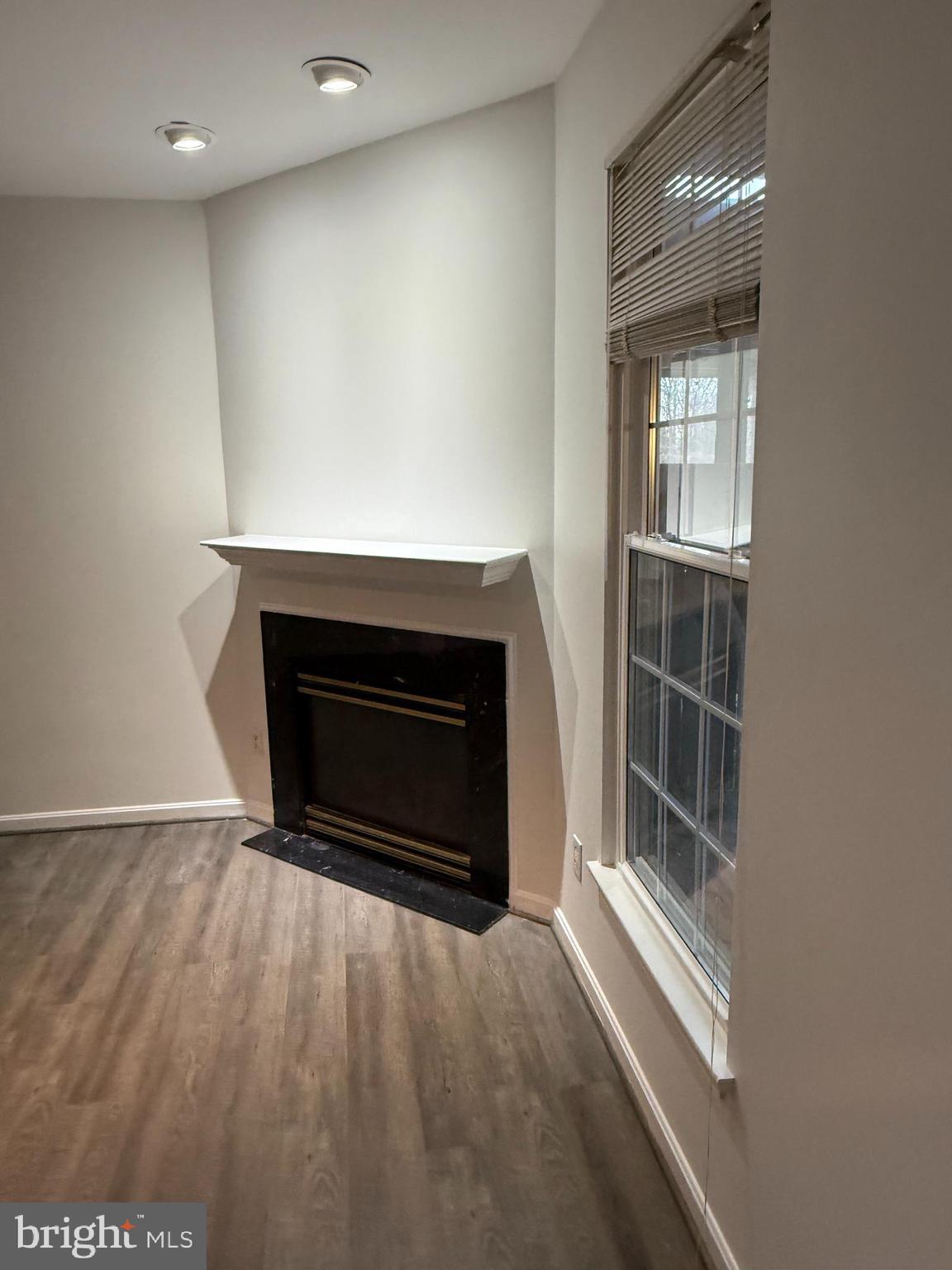 12976 Park Crescent Circle Herndon, VA 20171 - Photo 5 of 15 a living room with a fireplace