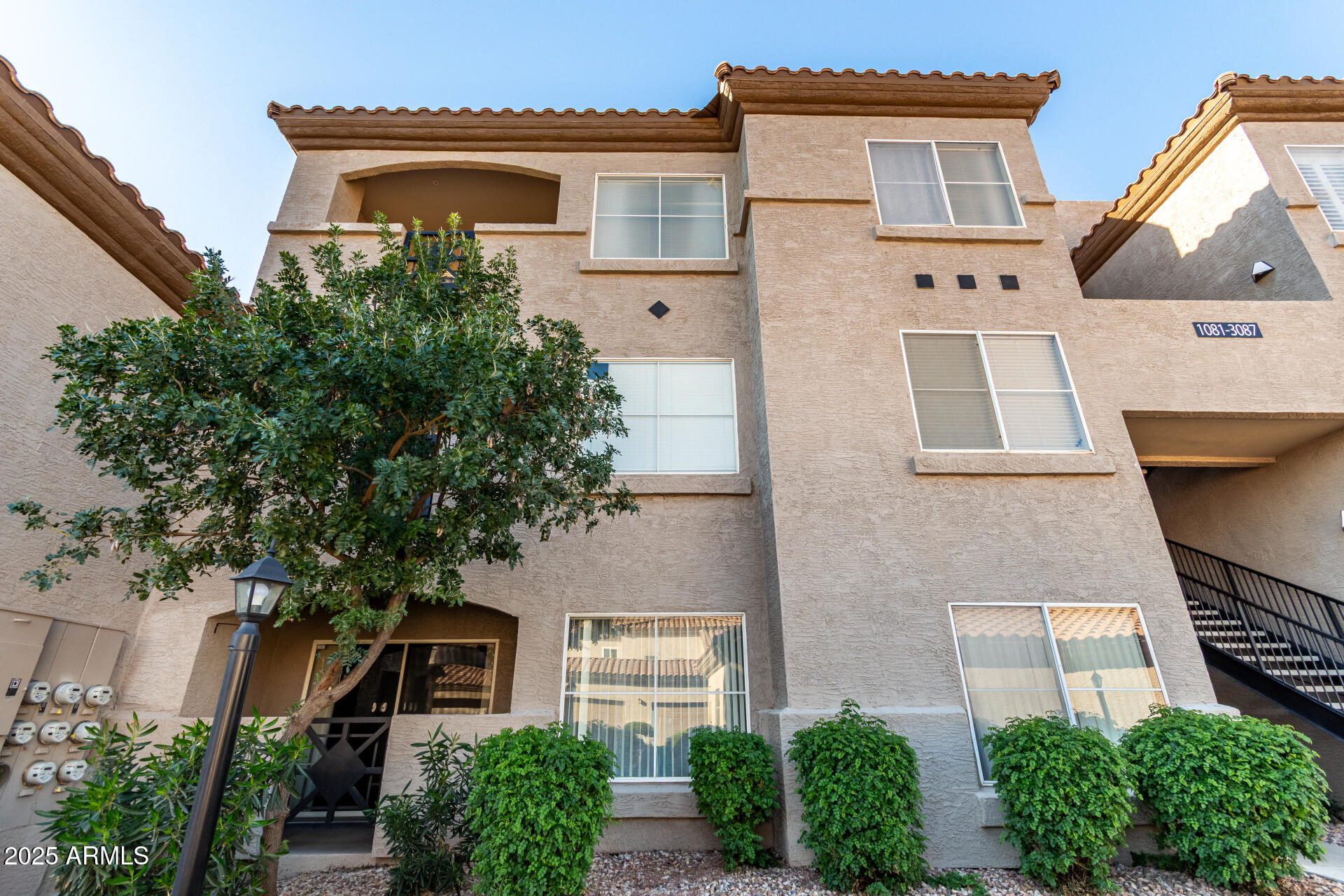 3236 East Chandler Boulevard, Unit 1082 Phoenix, AZ 85048 - Photo 1 of 28 front view of a house with a tree