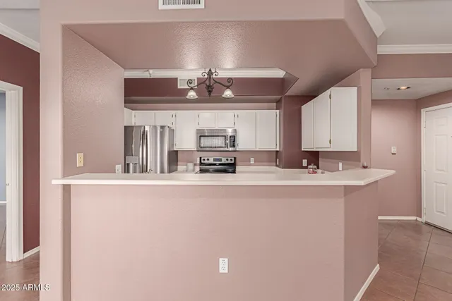 a kitchen with a sink stove and microwave