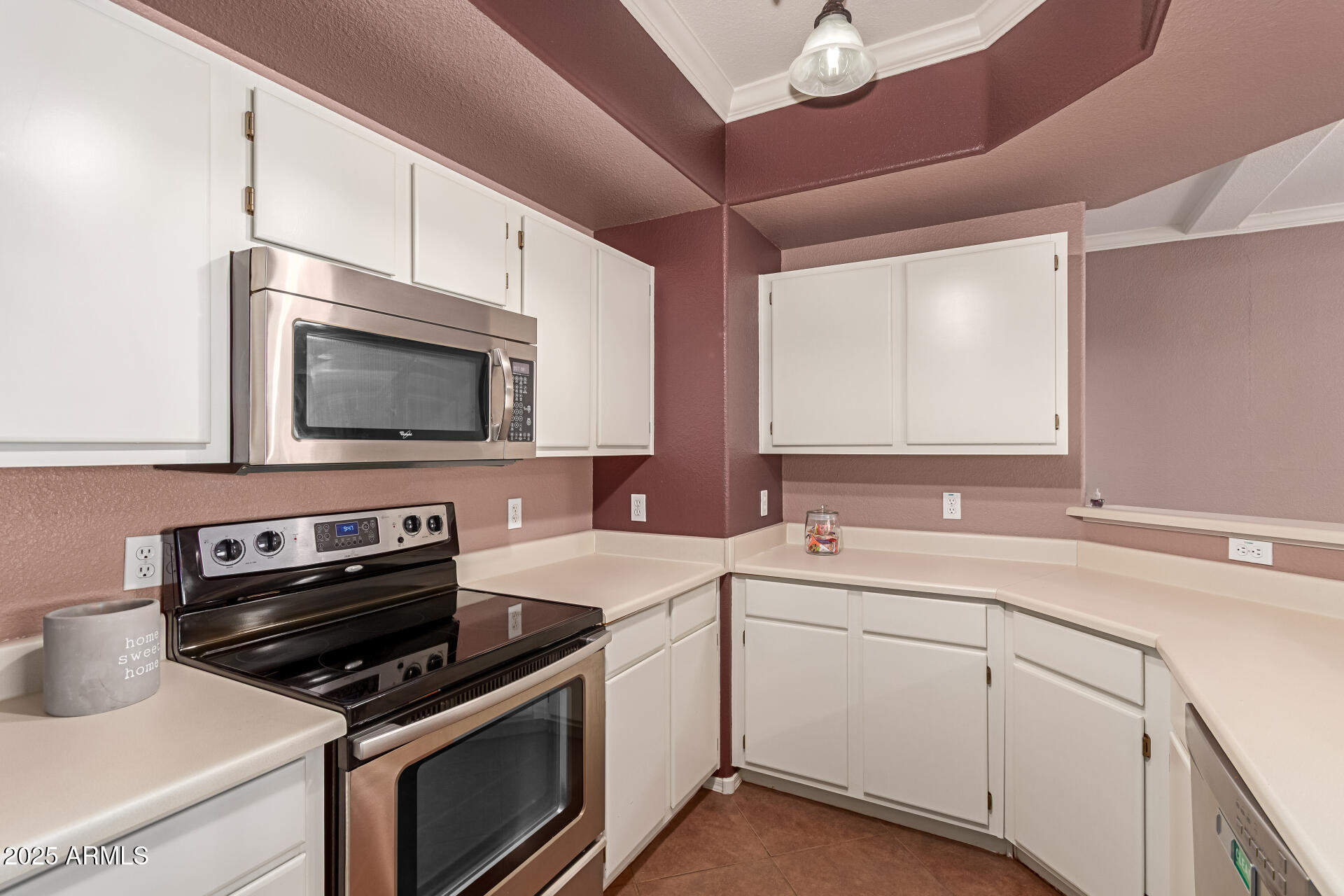 3236 East Chandler Boulevard, Unit 1082 Phoenix, AZ 85048 - Photo 13 of 28 a kitchen with a sink stove and microwave