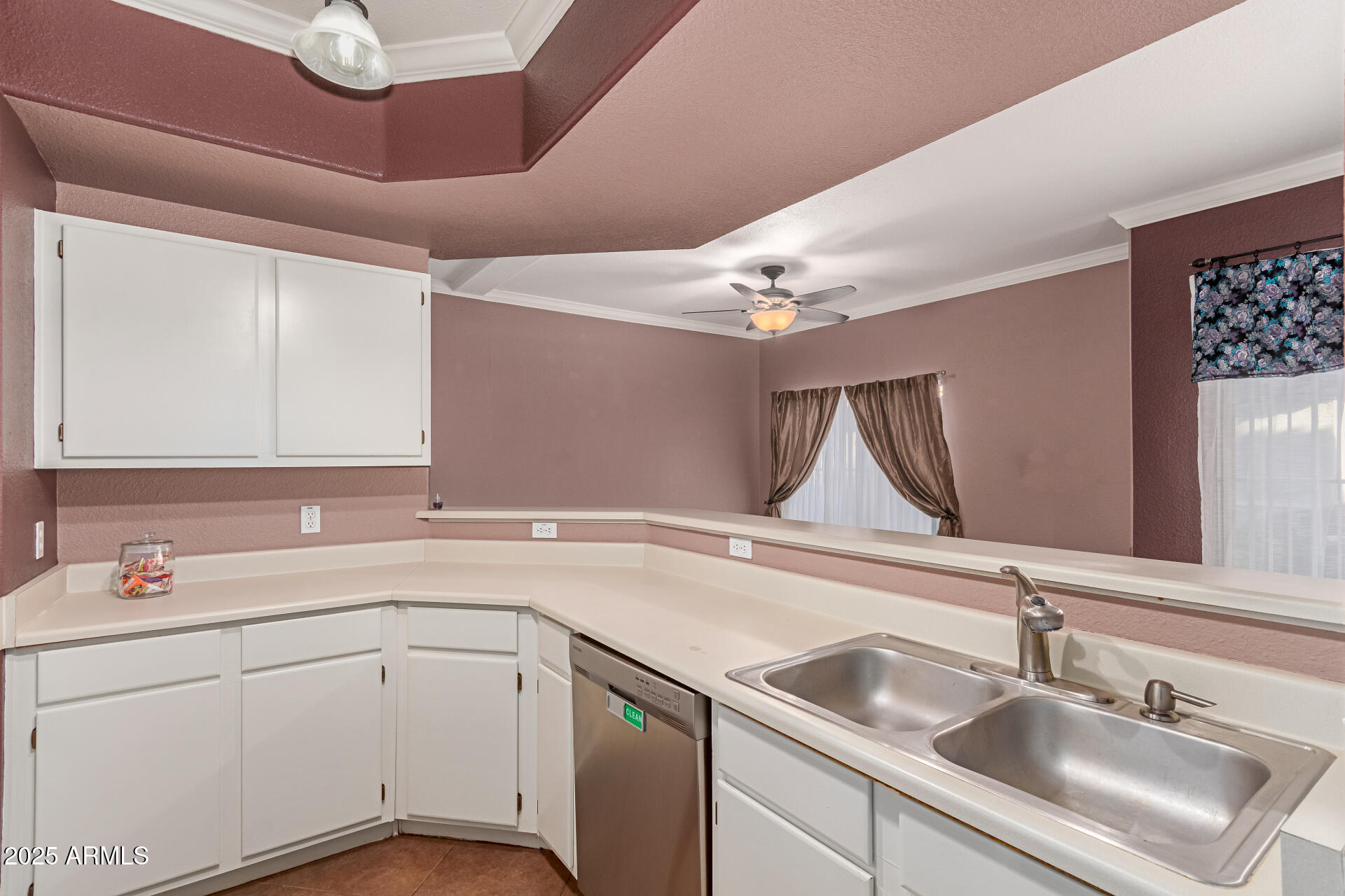3236 East Chandler Boulevard, Unit 1082 Phoenix, AZ 85048 - Photo 14 of 28 a kitchen with a sink dishwasher and white cabinets with wooden floor